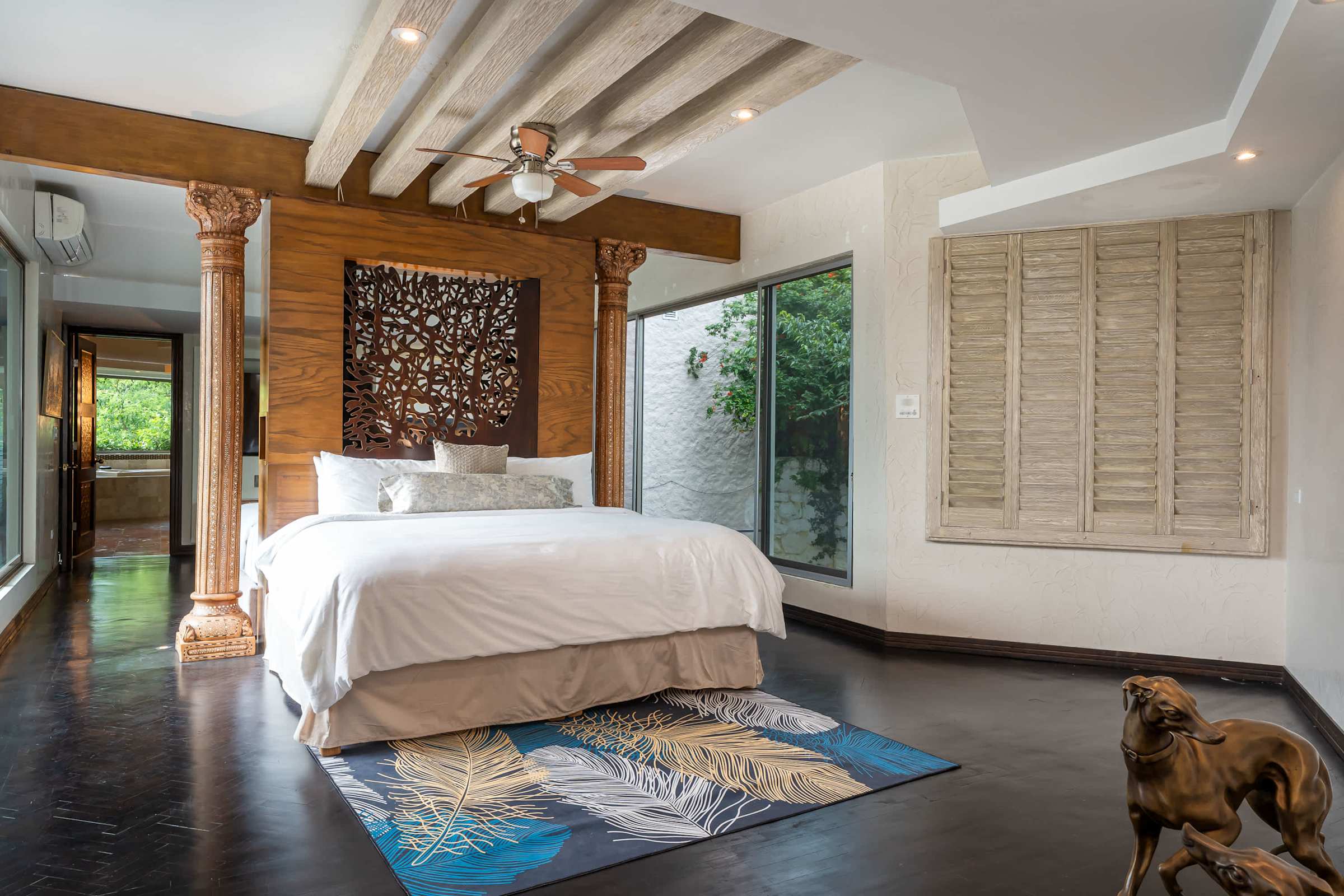 Guest suite king bed with garden views