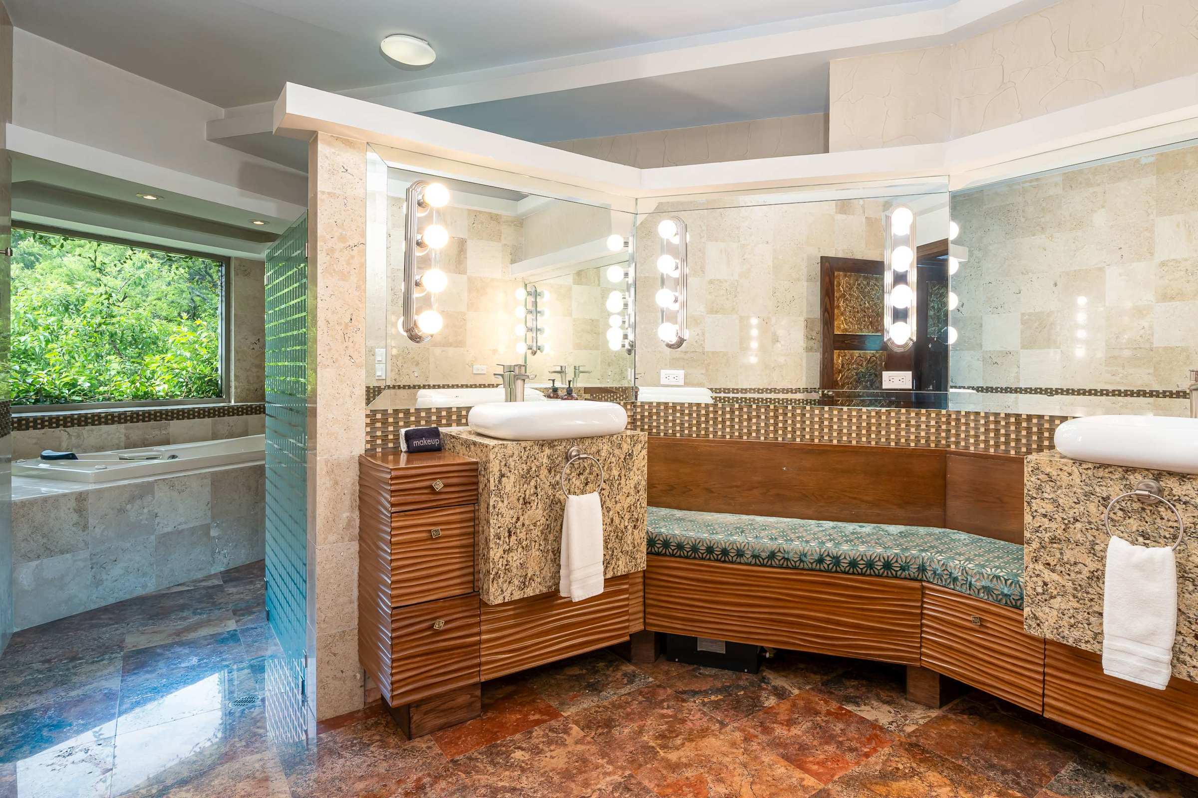 Guest suite bathroom with double vanity and bathtub