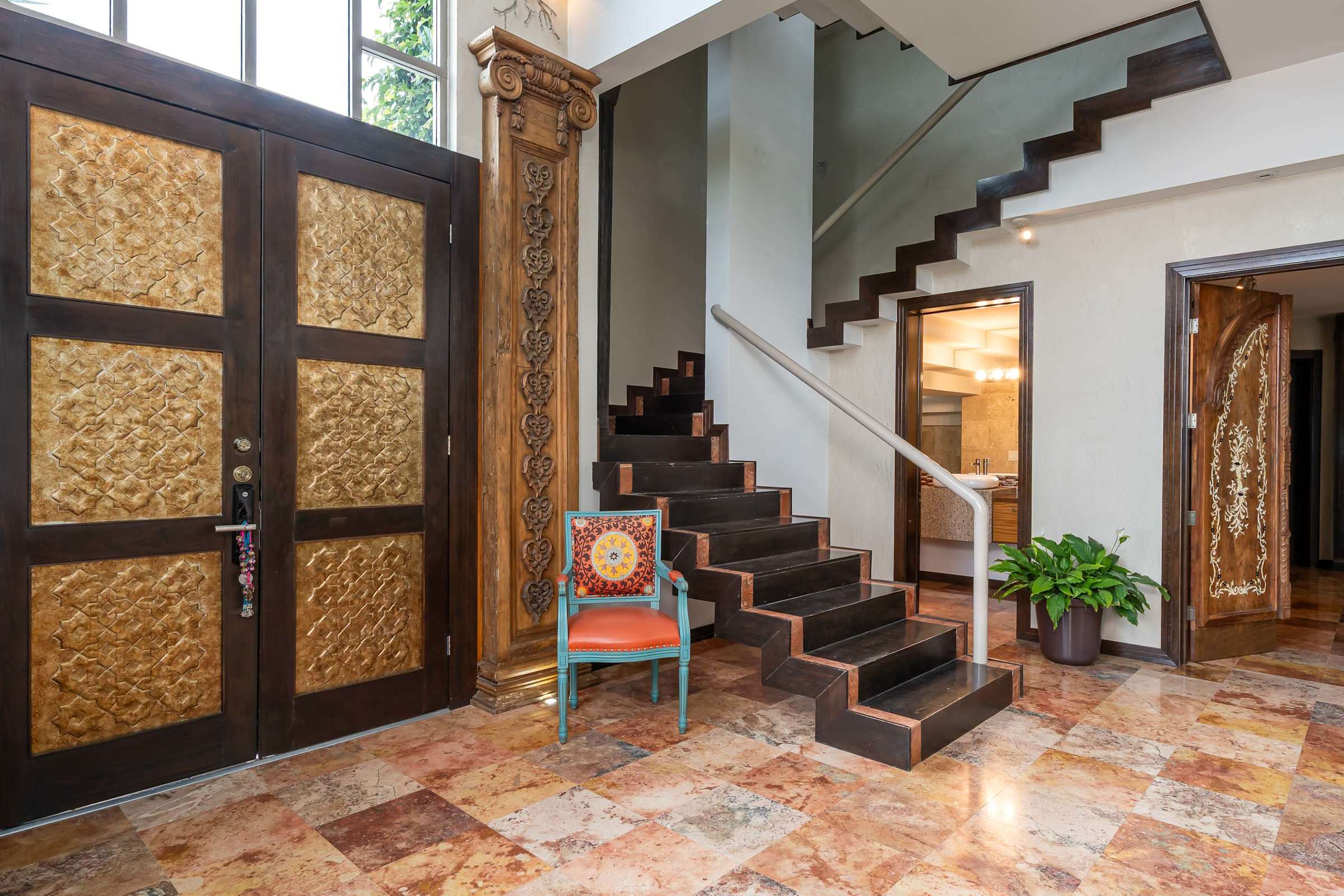 Staircase leading to the upper level guest suite