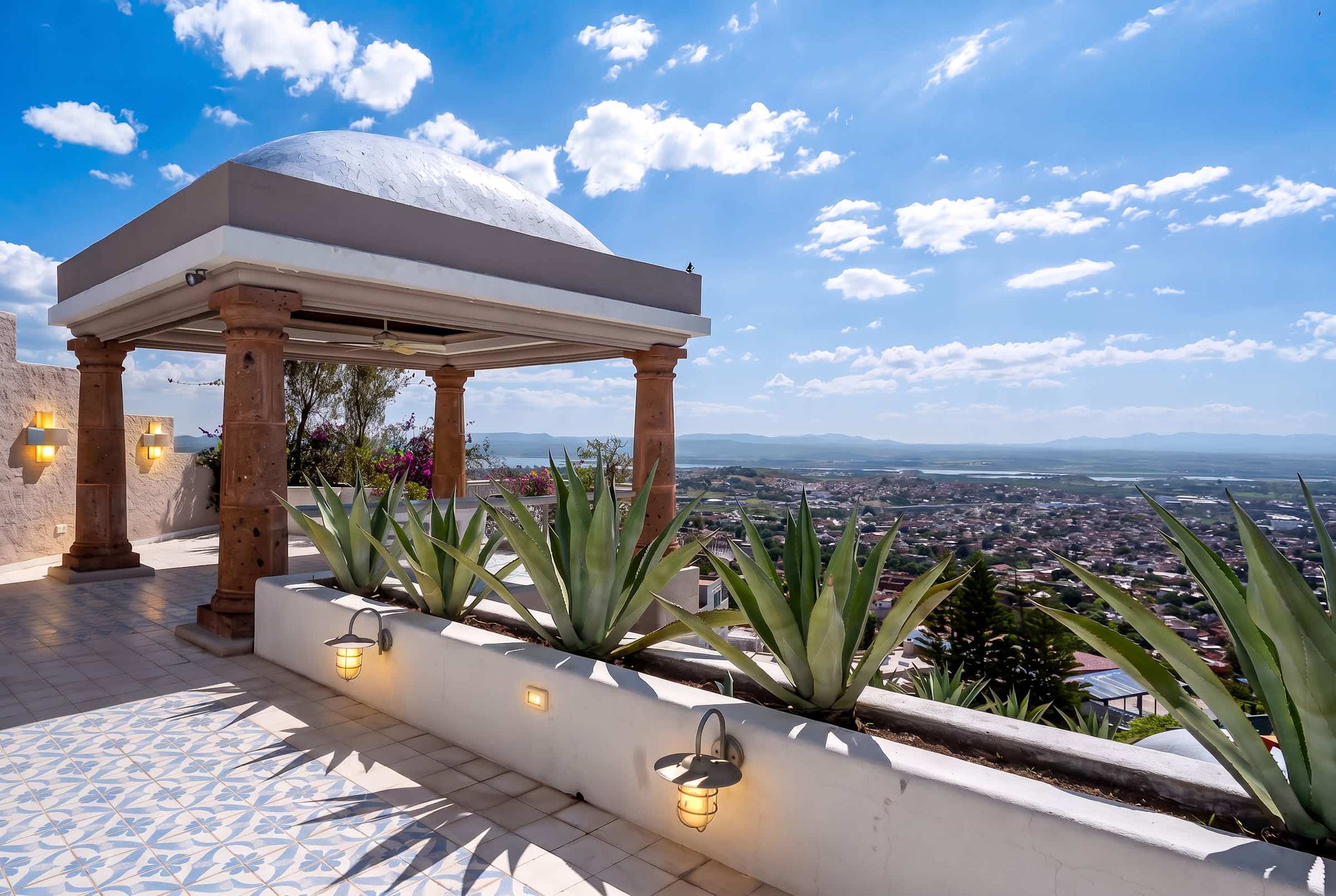 Top-level patio terrace with outdoor dining and panoramic views of San Miguel de Allende