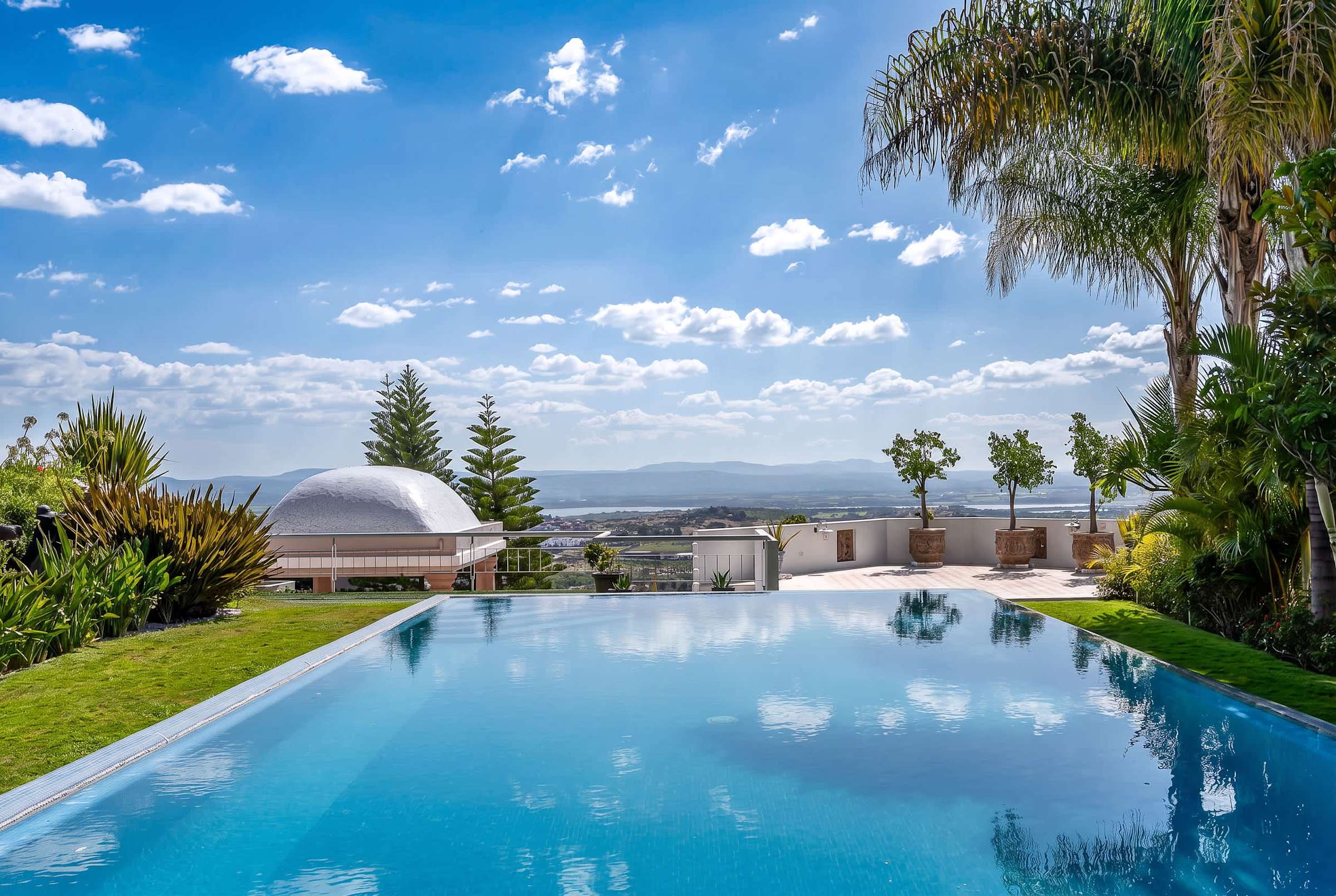 Shared outdoor infinity pool with panoramic views of San Miguel de Allende