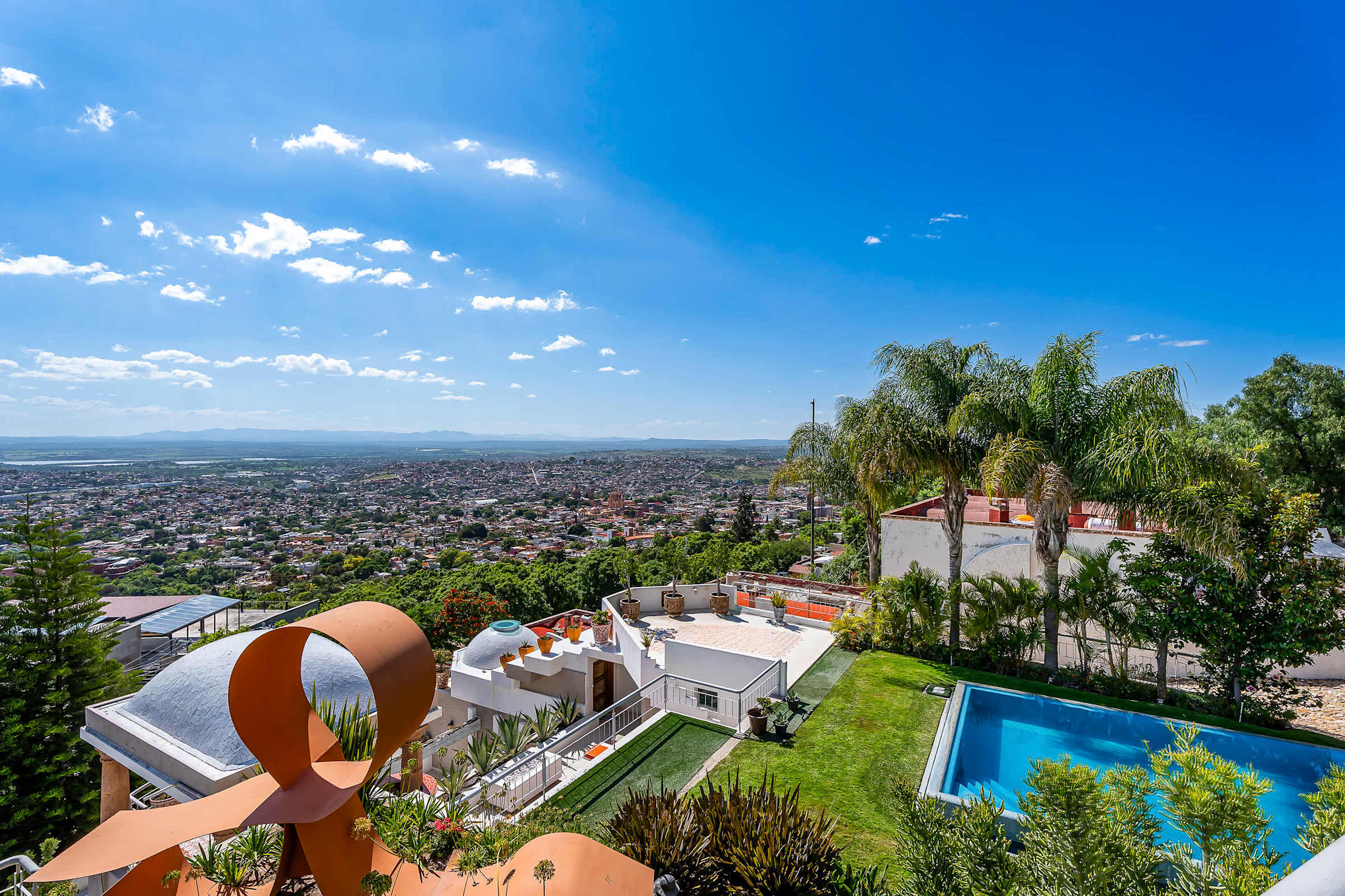 Shared outdoor infinity pool with panoramic views of San Miguel de Allende