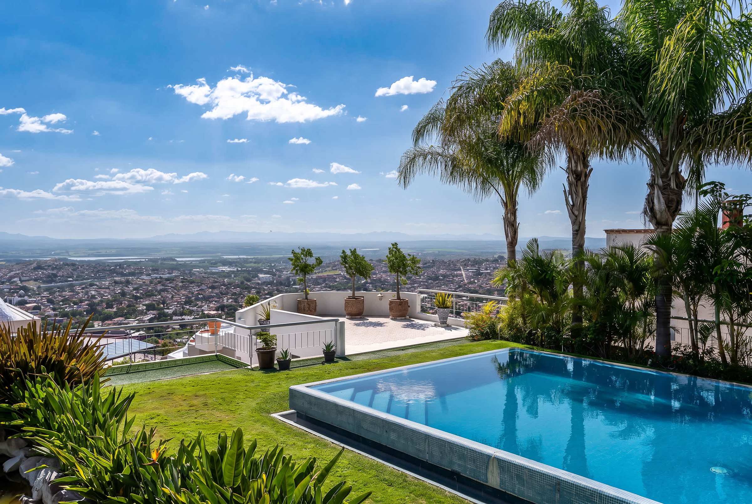Shared outdoor infinity pool with panoramic views of San Miguel de Allende