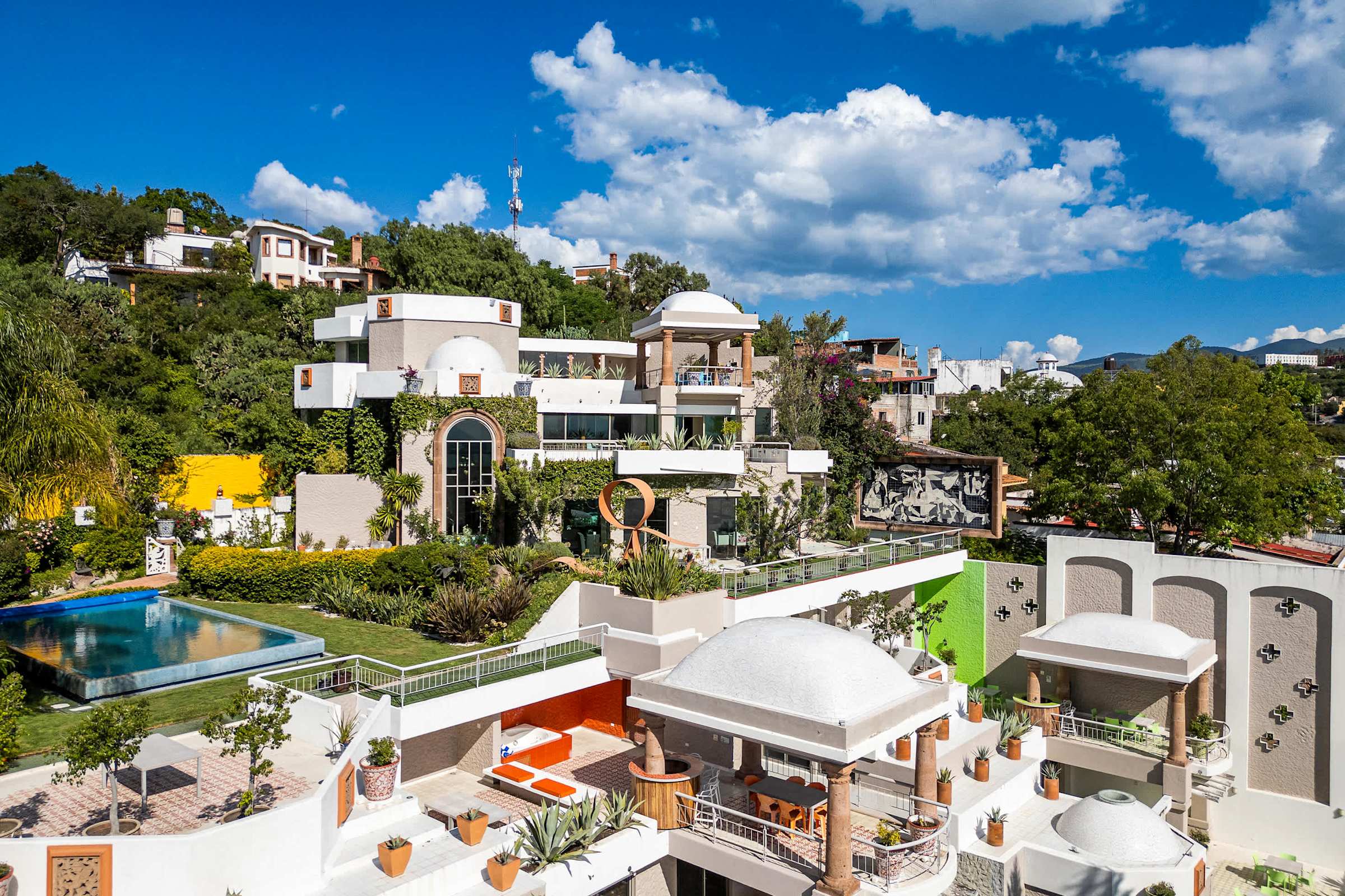 Panoramic exterior photo of the entire property