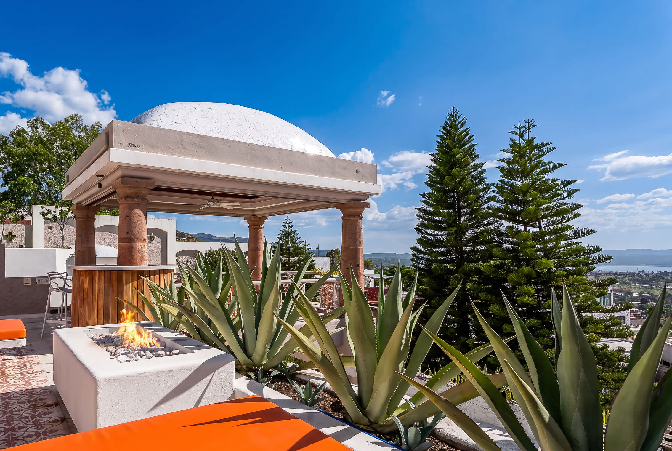 Private terrace with hot tub, fire pit, outdoor dining and panoramic city views