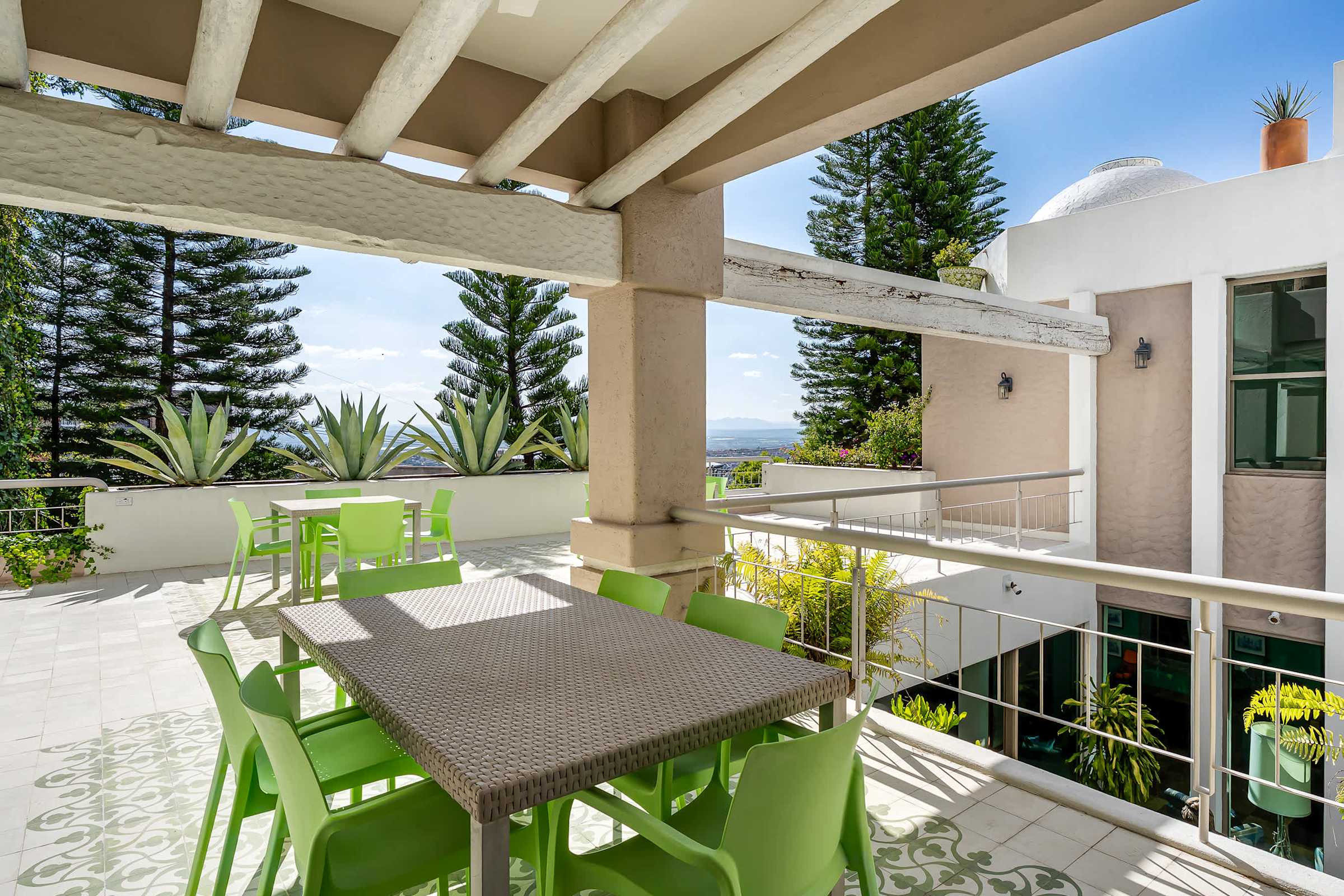 Top-level patio with extended terrace and outdoor dining