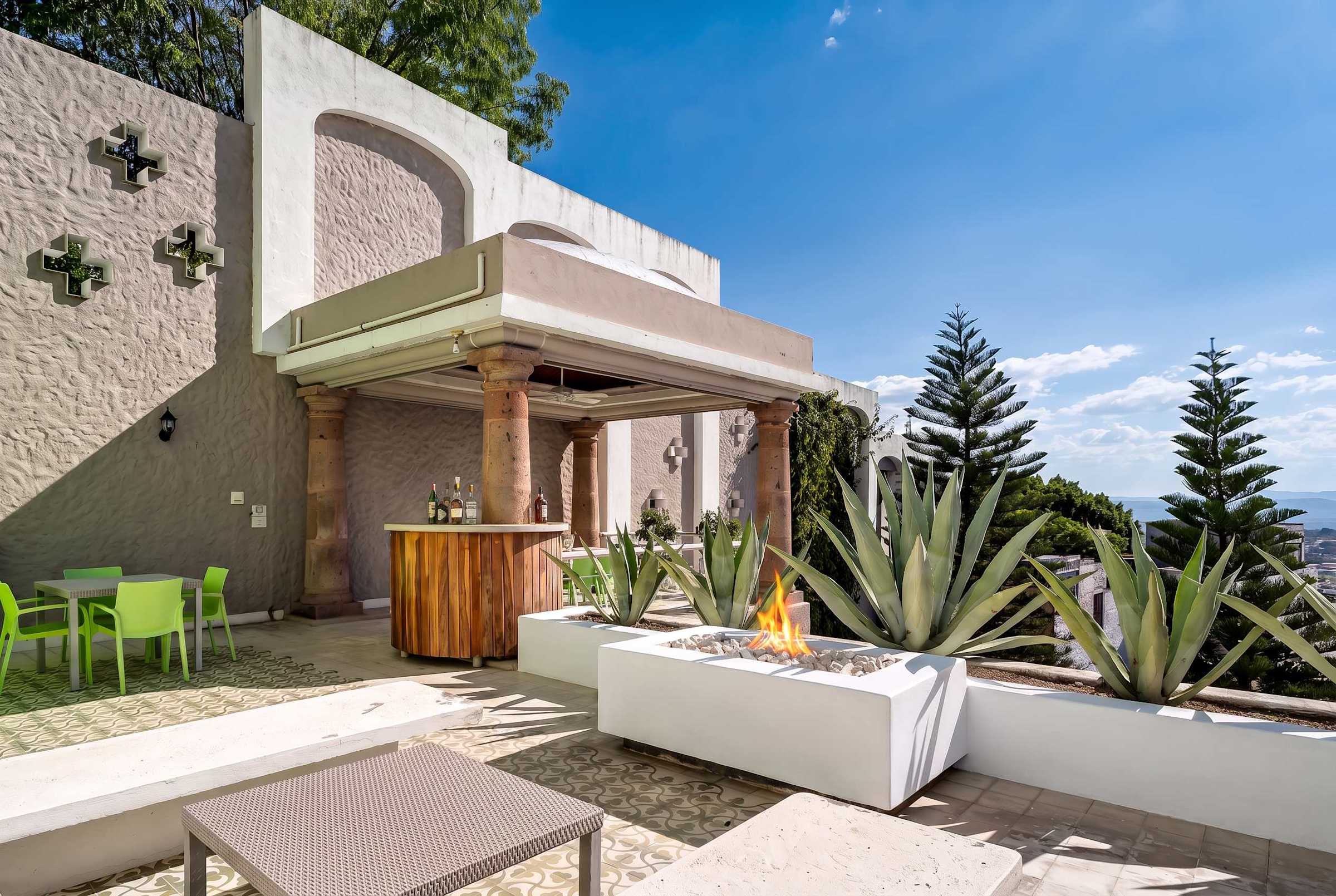 Second level terrace with bar, fire pit and outdoor dining
