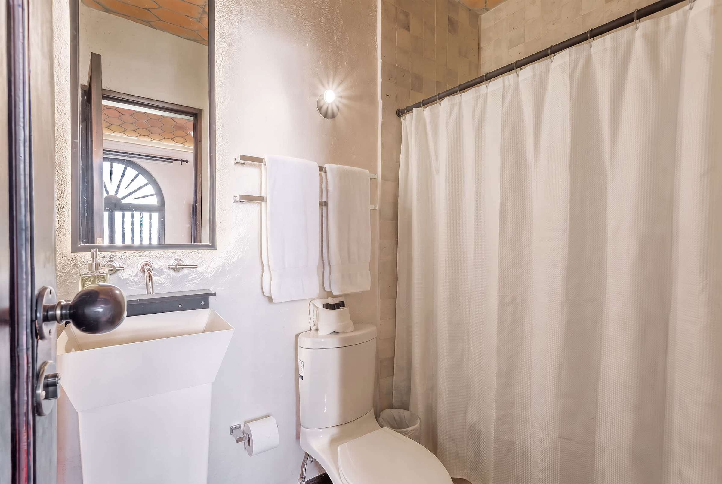 Ensuite bathroom with a walk-in shower and vanity mirror