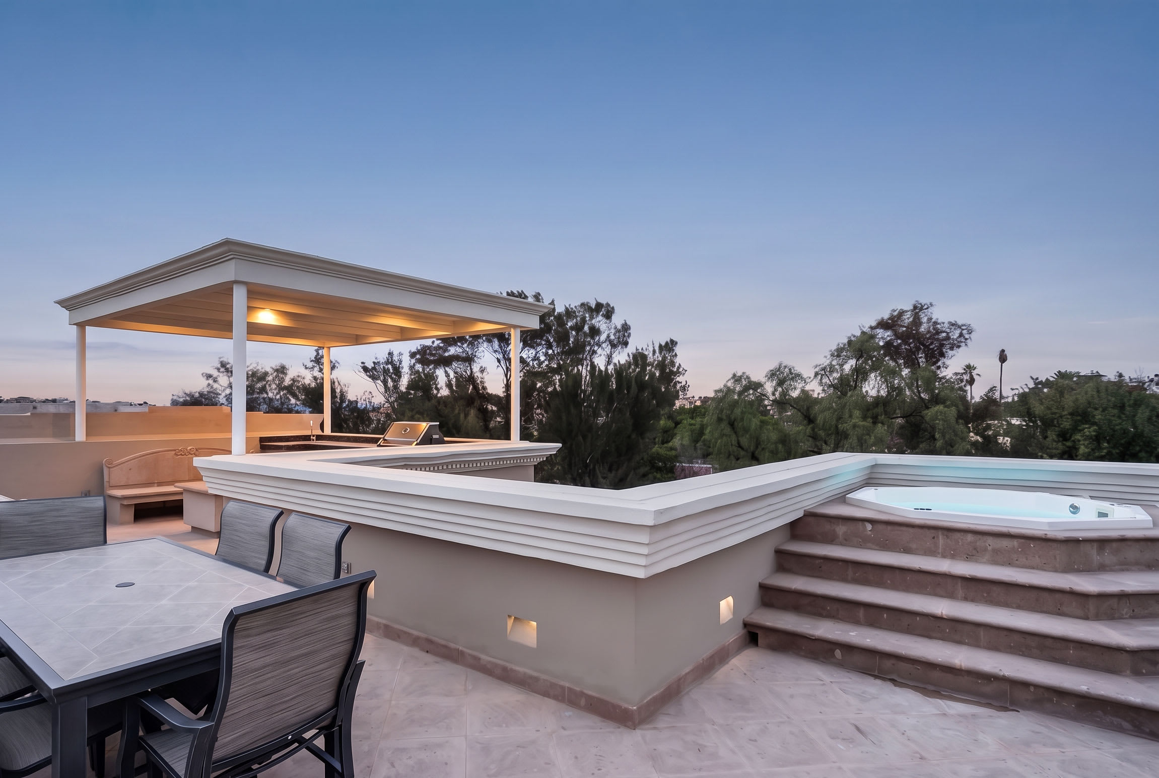 Private rooftop with outdoor kitchen, dining and hot tub