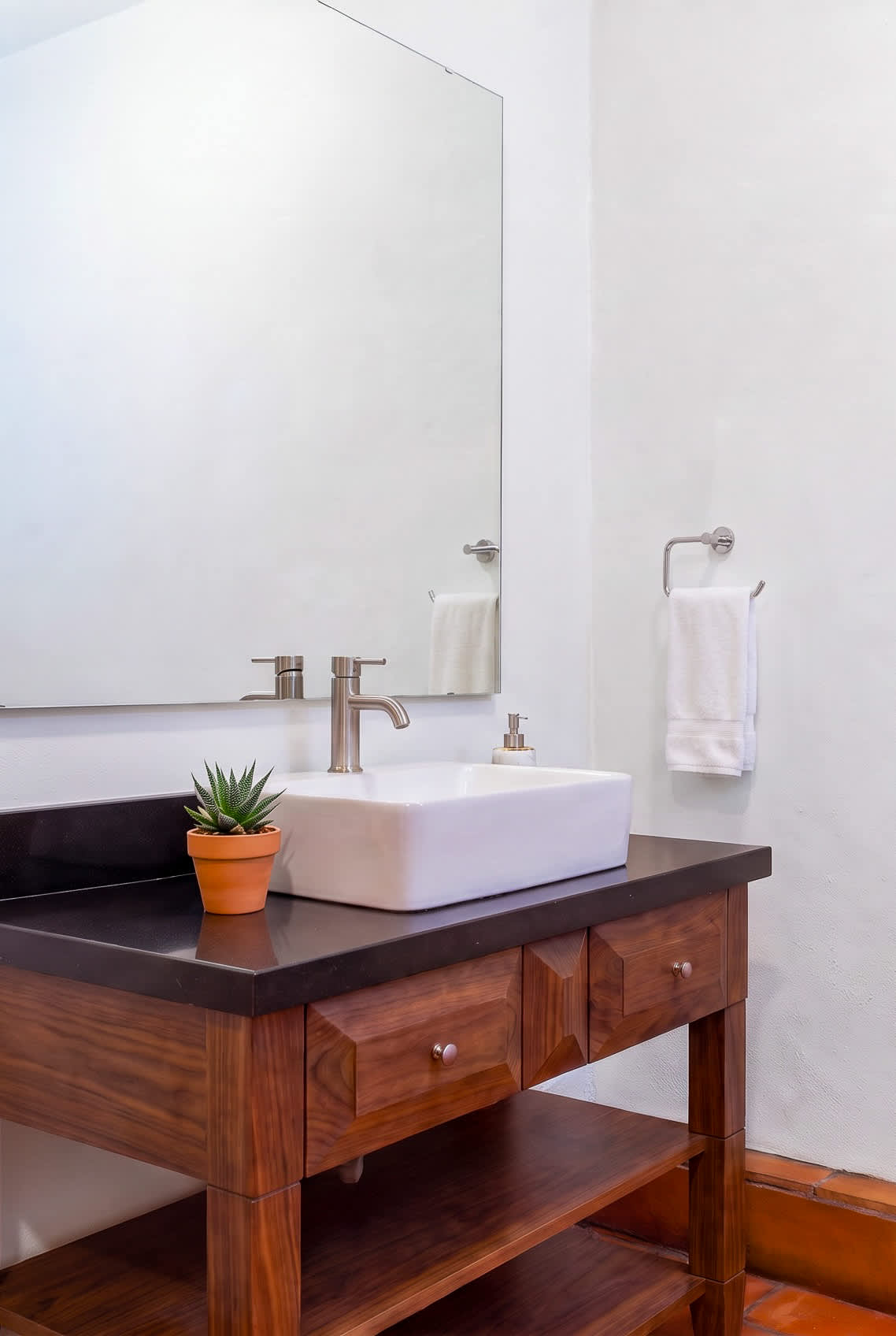 An additional half bath is located on the rooftop for outdoor entertainment