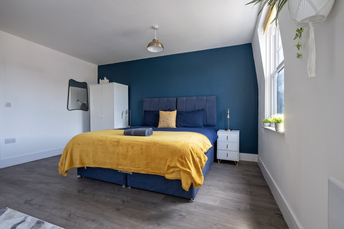 Bedroom with storage, iron, hairdryer provided.