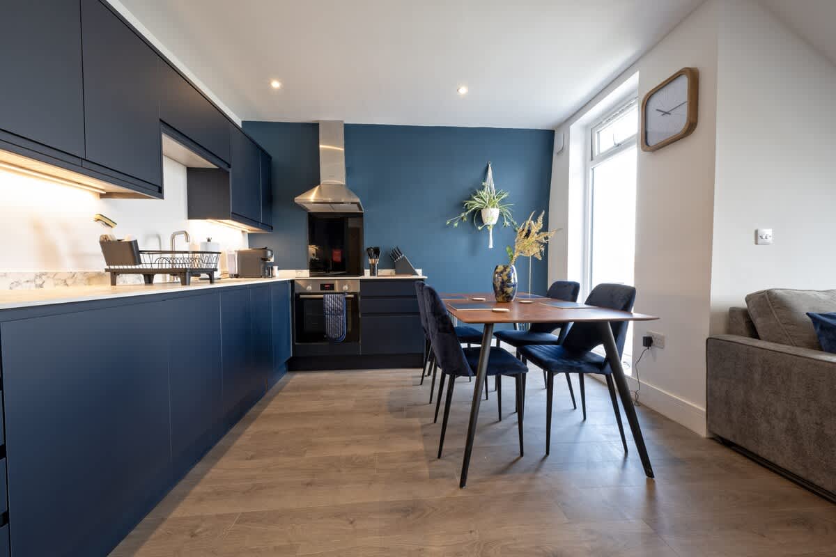 Fully Stocked Kitchen and Dining Area
