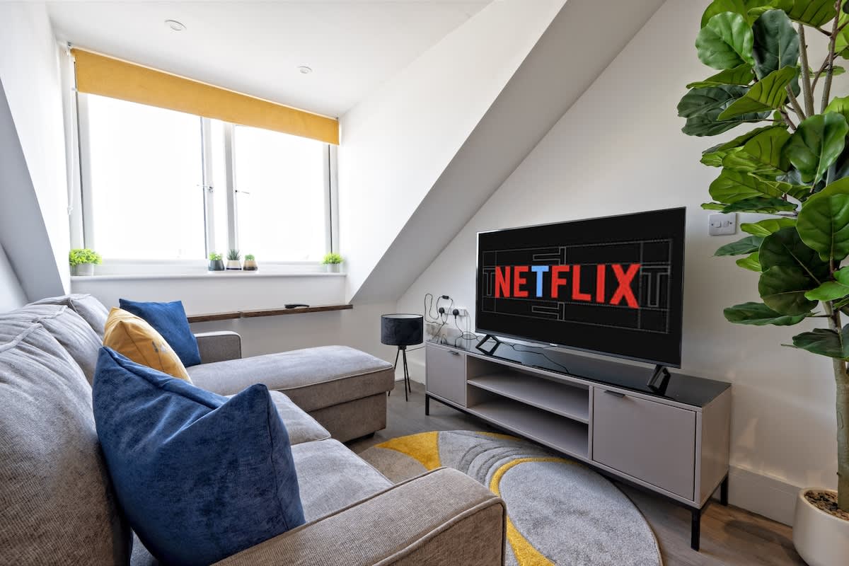 The Gold Residence: Living room area with 50 inch QLED TV