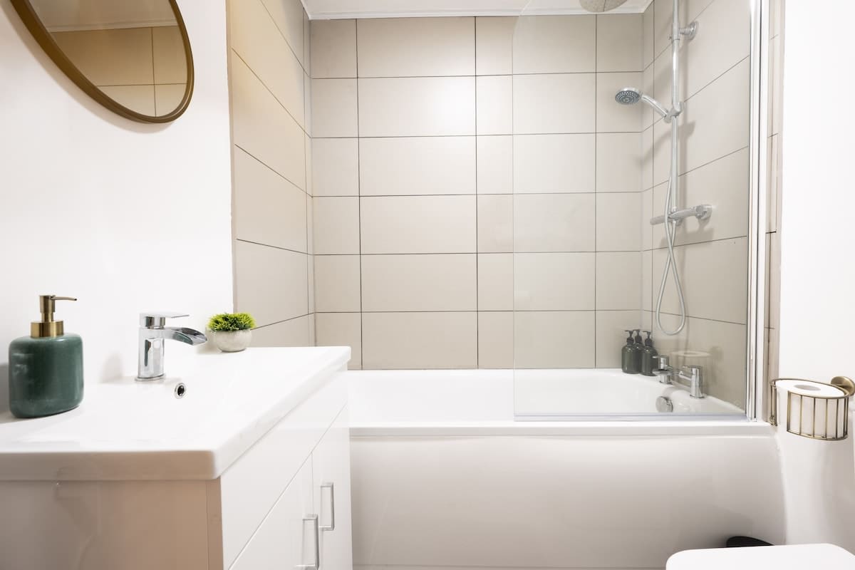 Bathroom with vanity sink and bathtub