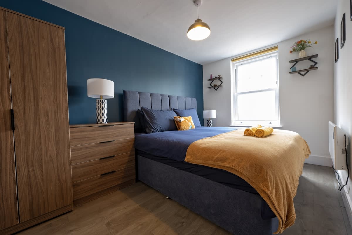 Stylish Super King bedroom with storage and natural light