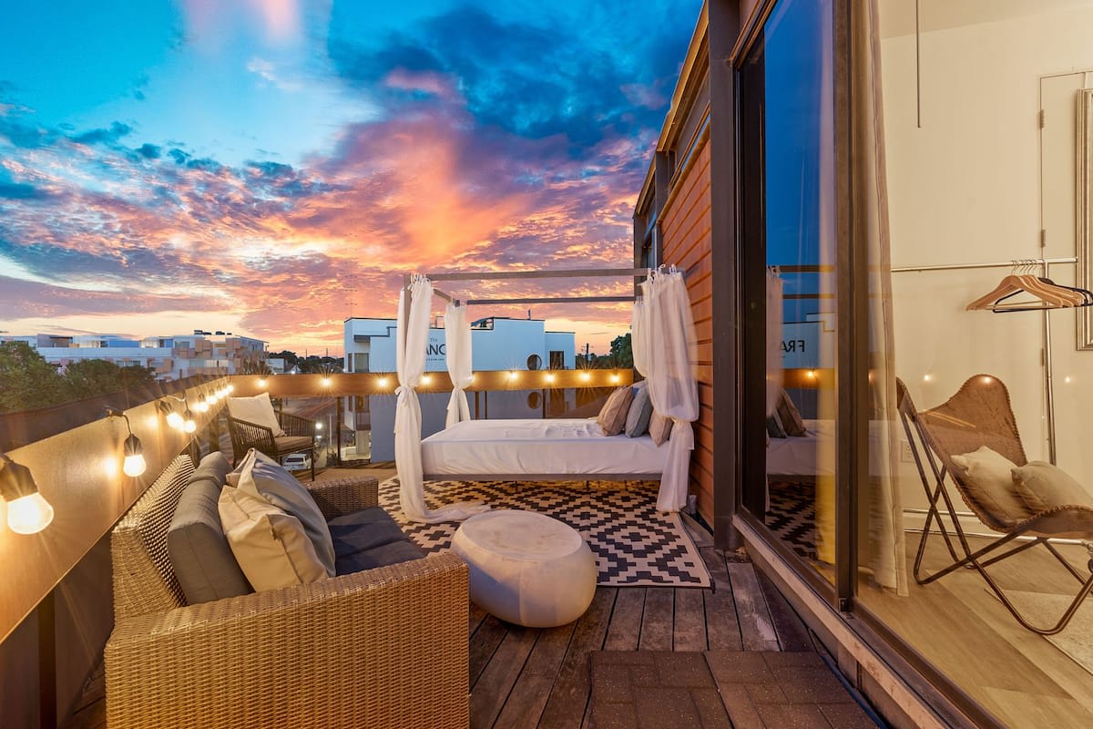 Outdoor living space with seating & daybed