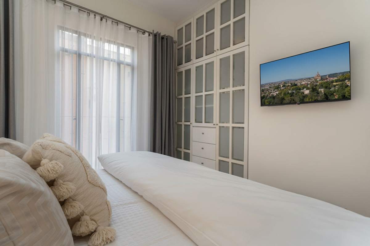 Main bedroom with TV & Closet