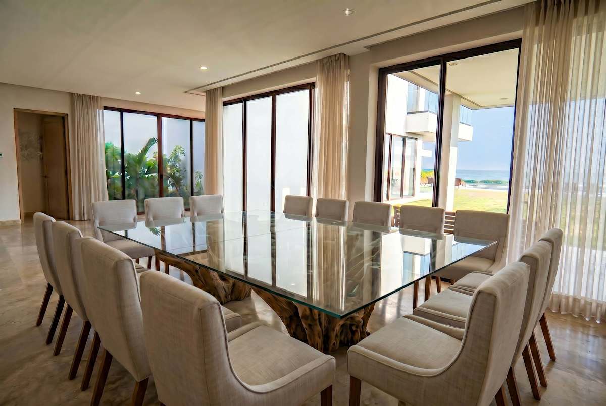 Grand formal dining room overlooking the pool and beach.