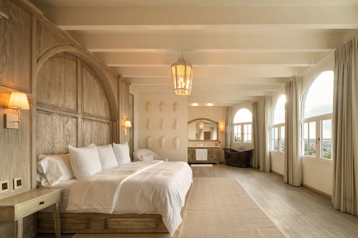 Suite 4: King bed, ensuite bathroom with shower and copper soaking tub, city and church views