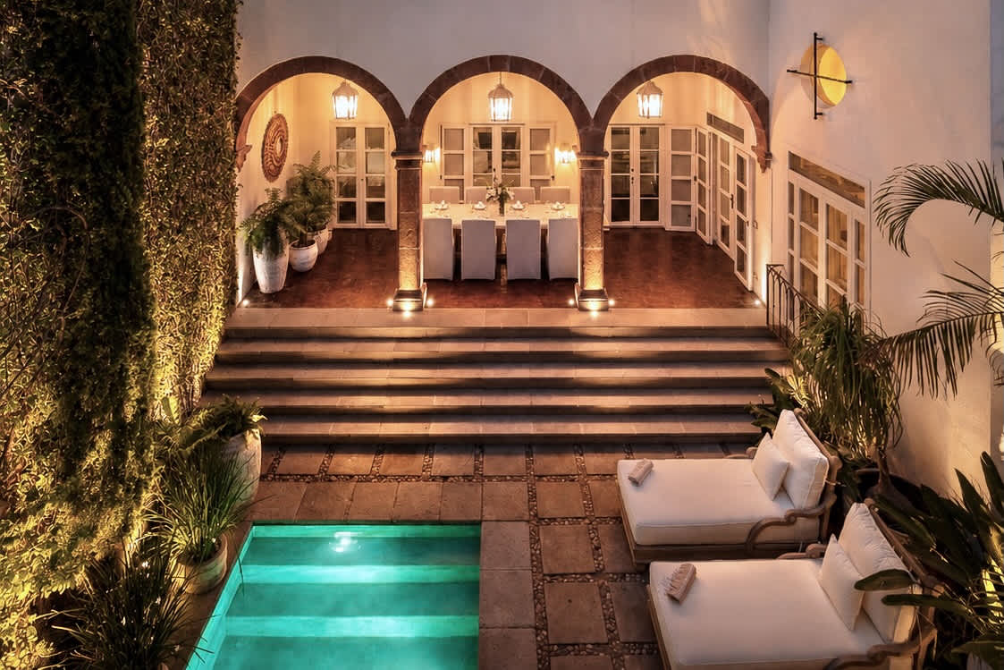 Arched dining terrace lit up at night