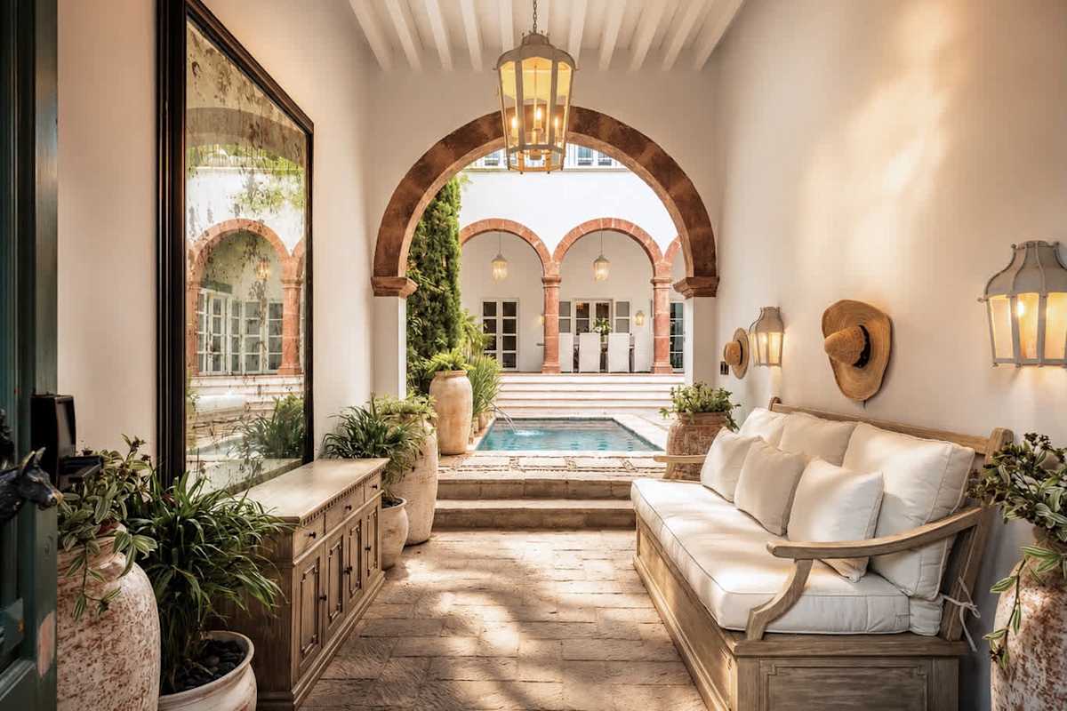 Covered lounge area overlooking the courtyard and pool