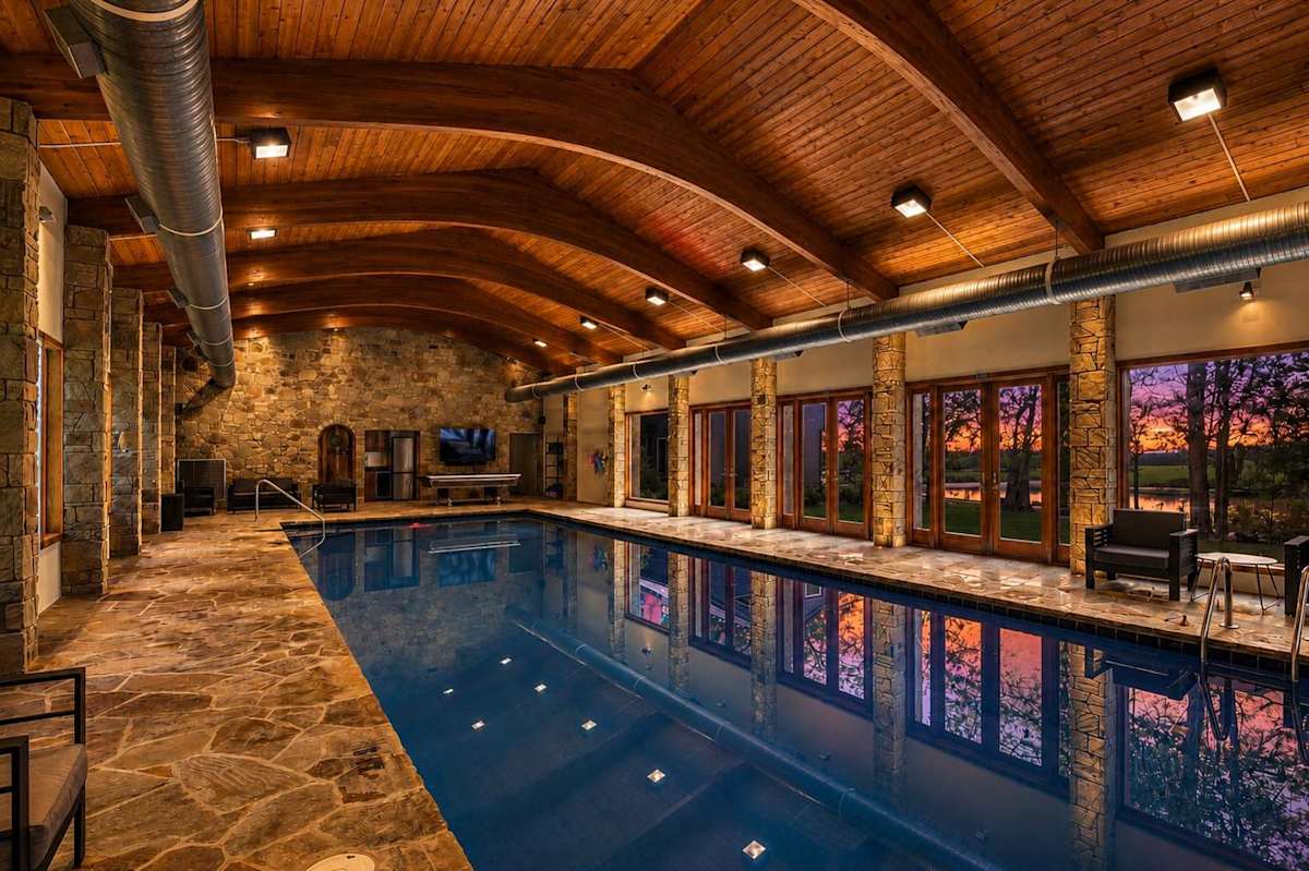 Massive Indoor Pool 50 feet long.  Heated year round with views of the swim pond.  