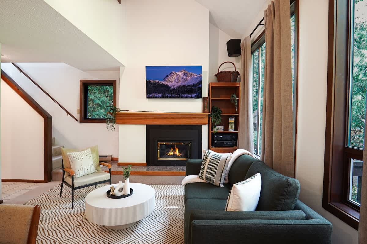 Living room with TV and fireplace