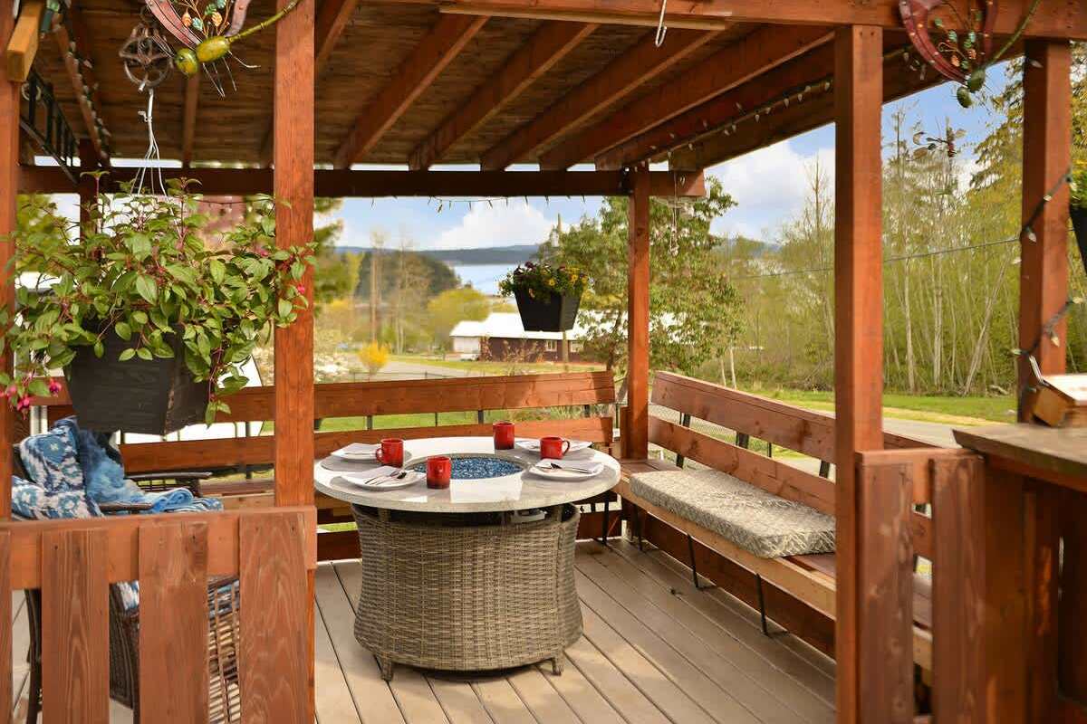 Spacious covered seating space on the deck with views.