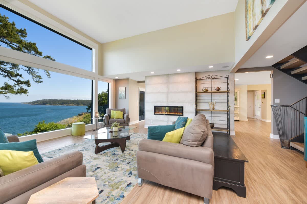 Main floor well appointed living room with spectacular views of the ocean and islands.