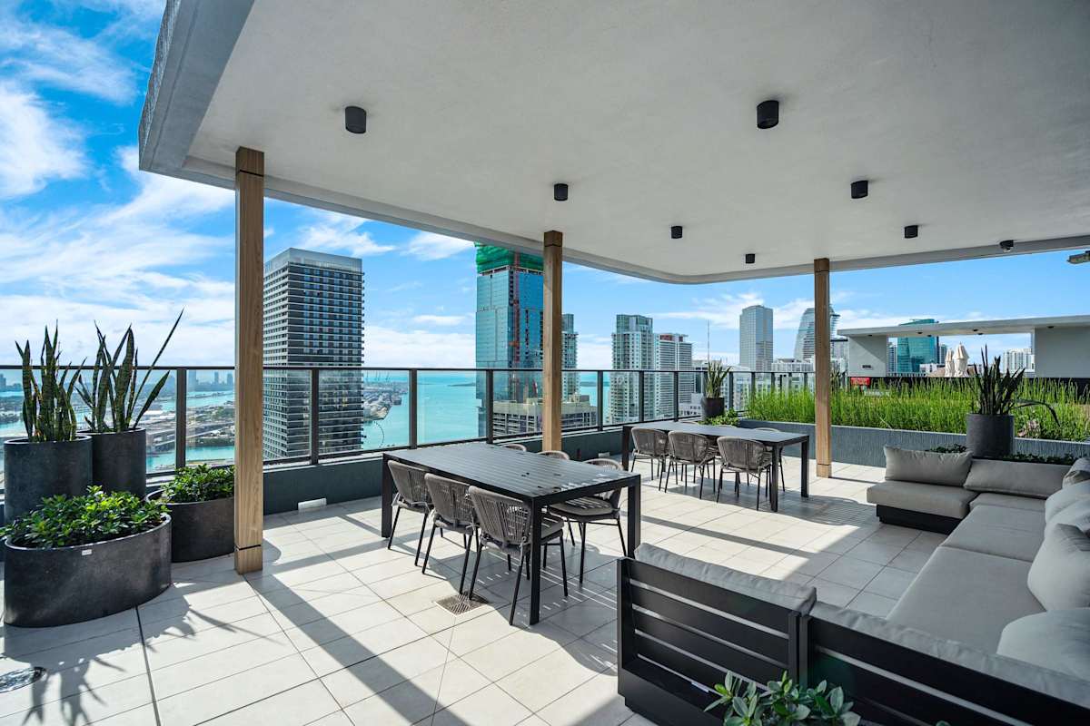 Rooftop terrace overlooking Downtown Miami skyline and Biscayne Bay