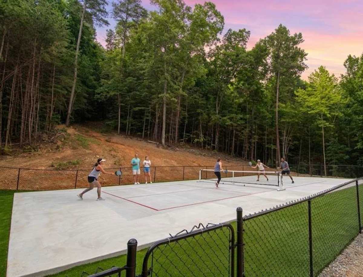 The communal pickleball court is a short drive from Treetop Escapes