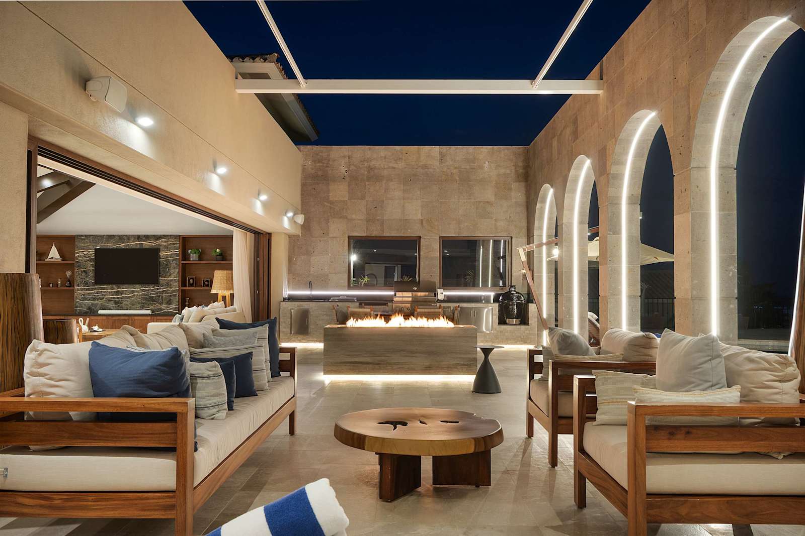 Outdoor lounge with fire pit at a Los Cabos vacation rental