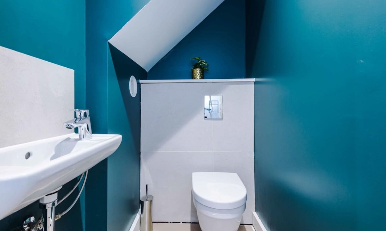 A compact half bathroom combining style and convenience for guests