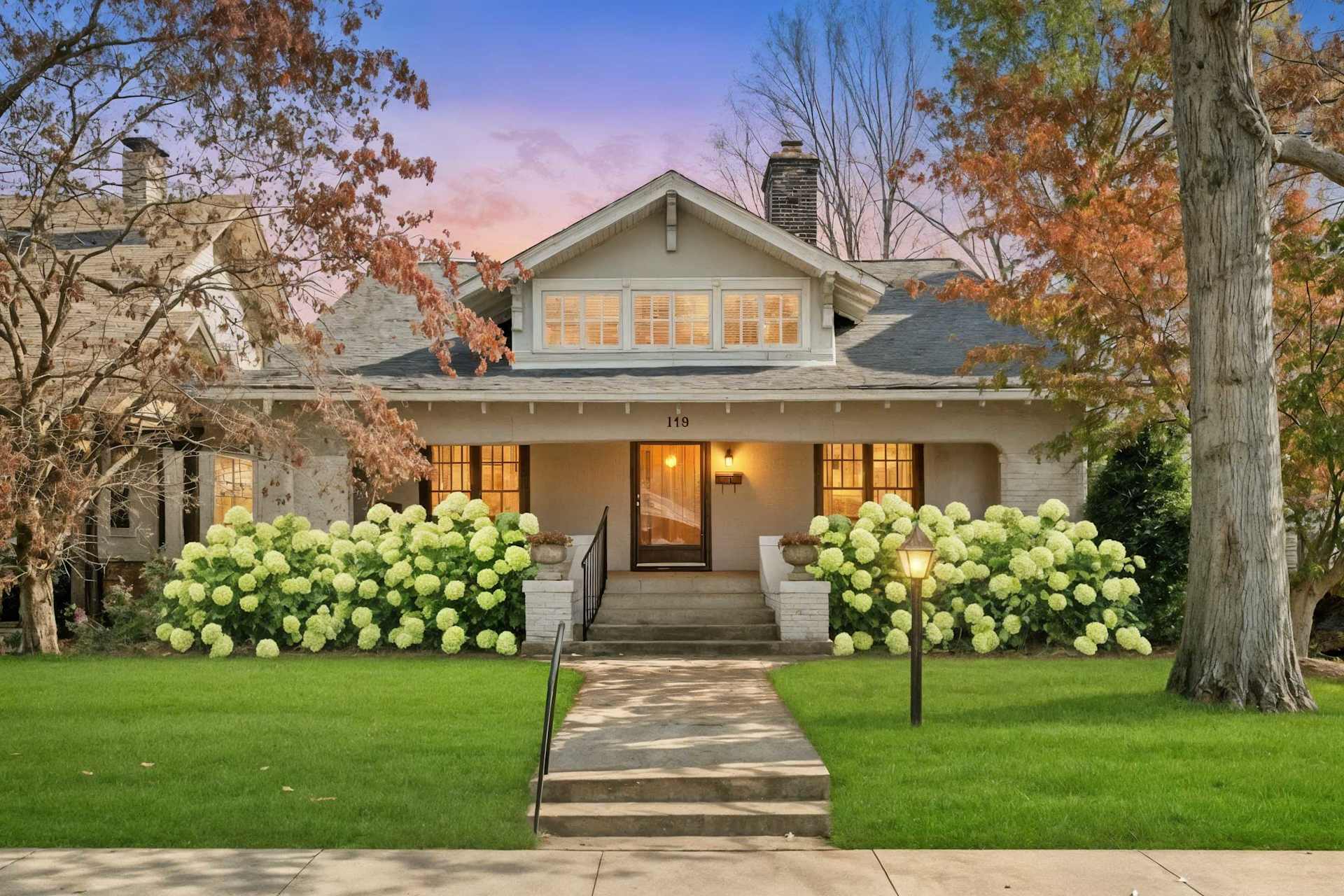 Pull up after a day of tastings and know you're home — porch lights on, hydrangeas framing the walk, a quiet street that doesn't feel like a rental block.