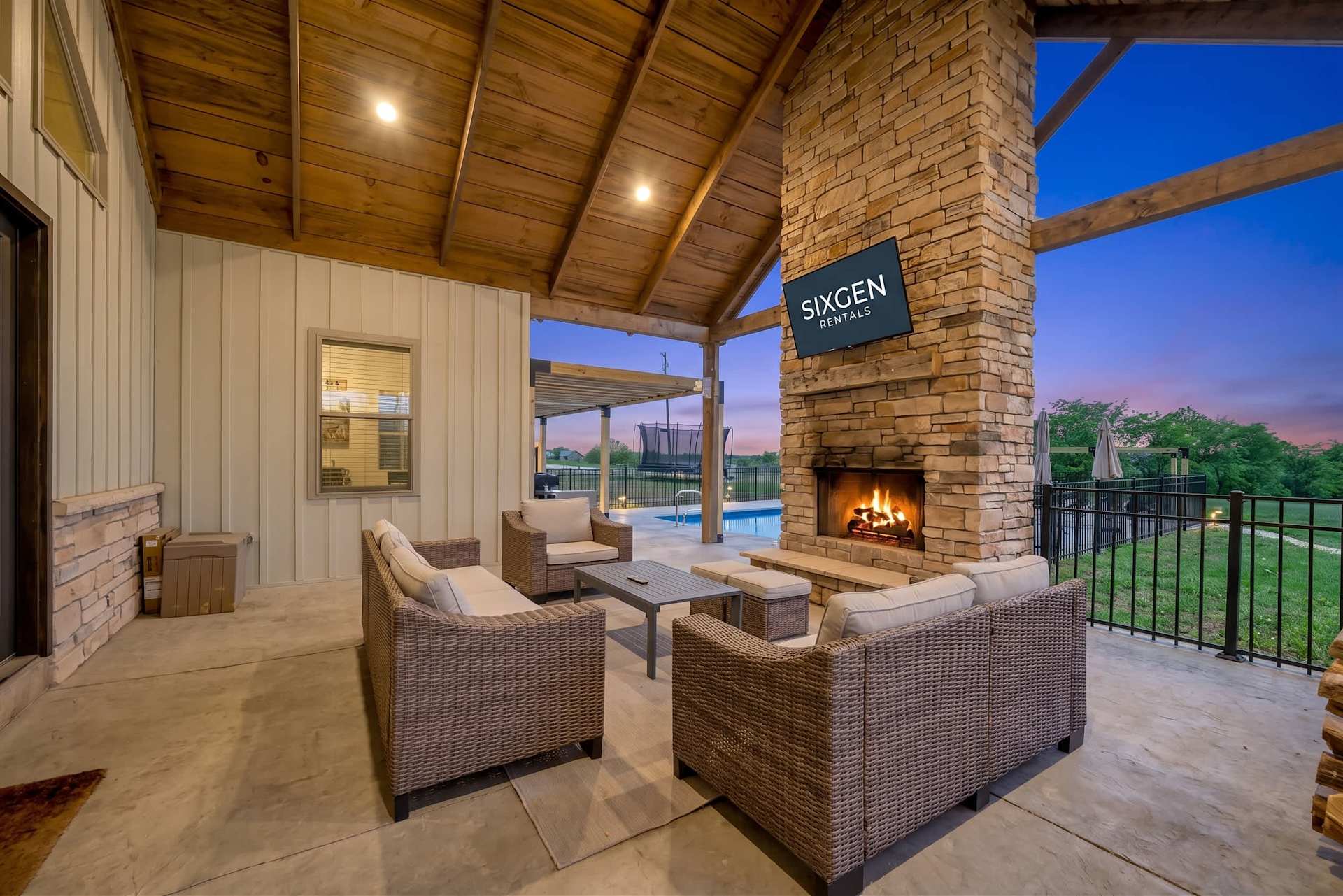 This outdoor living space was made for morning coffee, sunset conversations, and relaxing nights gathered around the TV with family and friends.