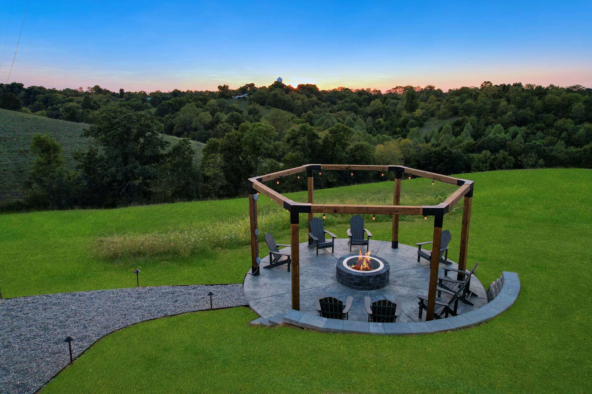 Pull up a chair. Marshmallows are optional, stories are not. The fire pit is where your whole group ends up every night.