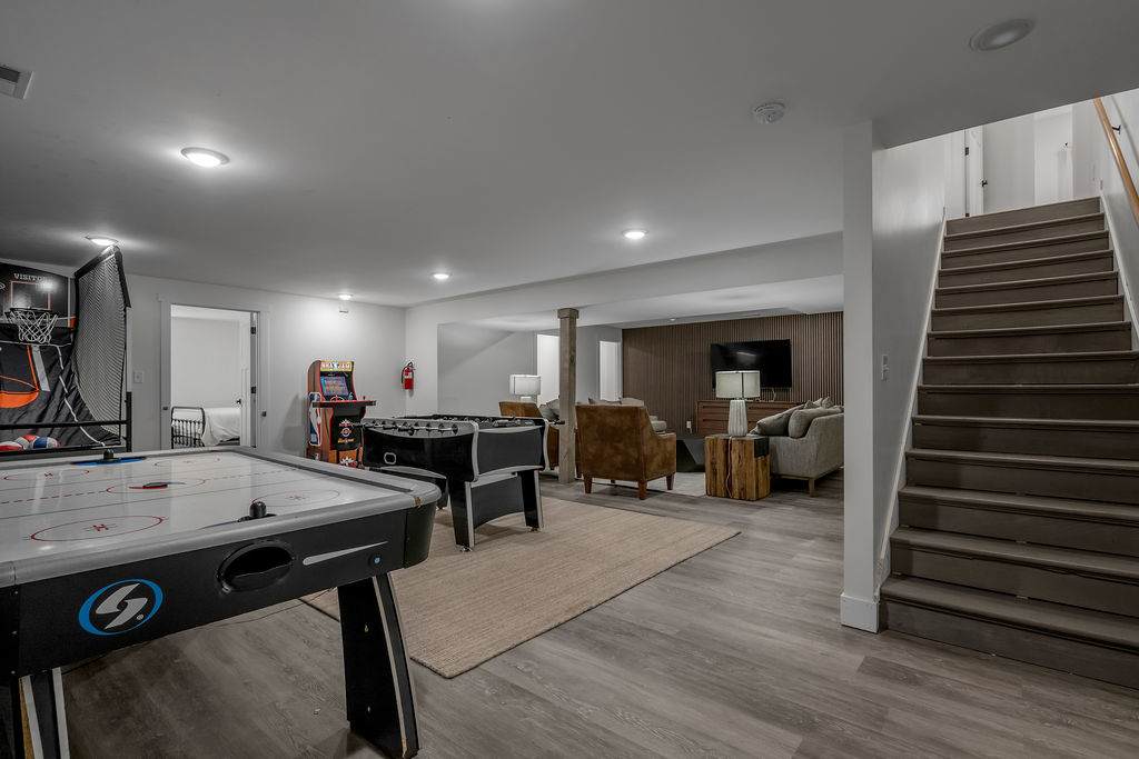 Settle the whole crew in the arcade basement where kids and adults square off over air hockey, foosball, and games all night.