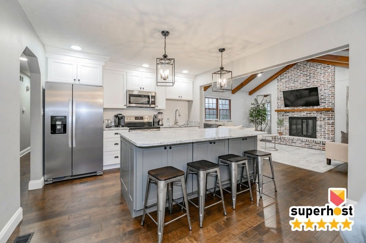 Pour the coffee, then hand off breakfast duty to whoever claims the island stool — four seats and brand-new appliances mean you'll actually want to cook together this trip.