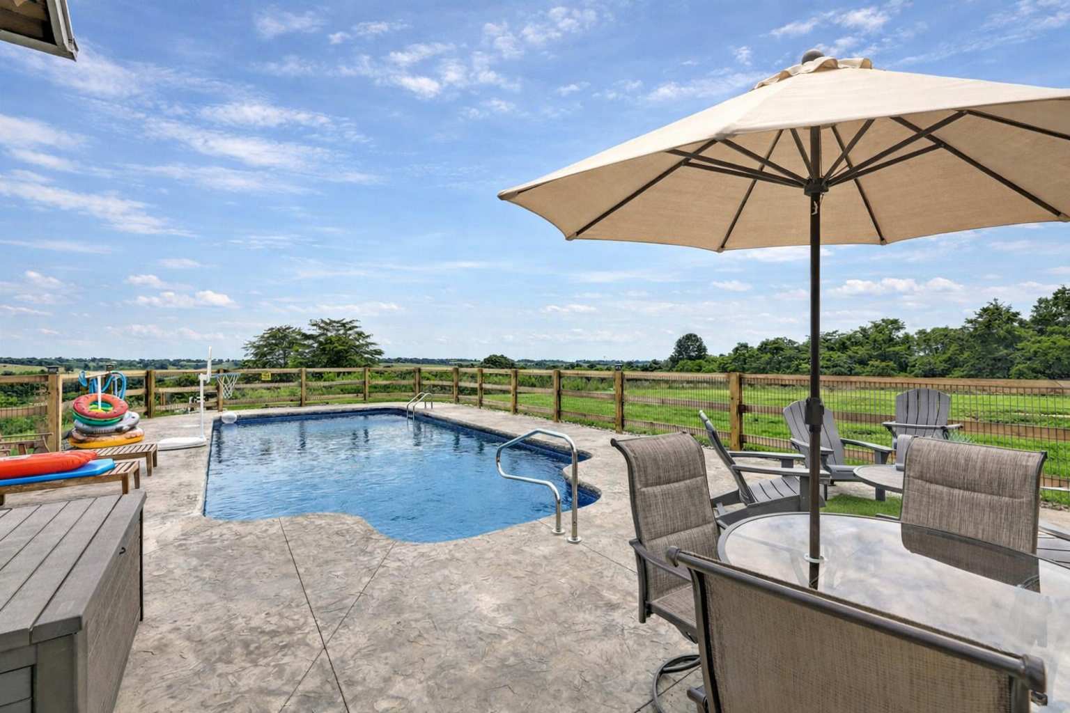 Grab a pool float, claim a lounger under the umbrella, and let the afternoon disappear — five private acres of farmland as your backdrop and nobody else in sight.