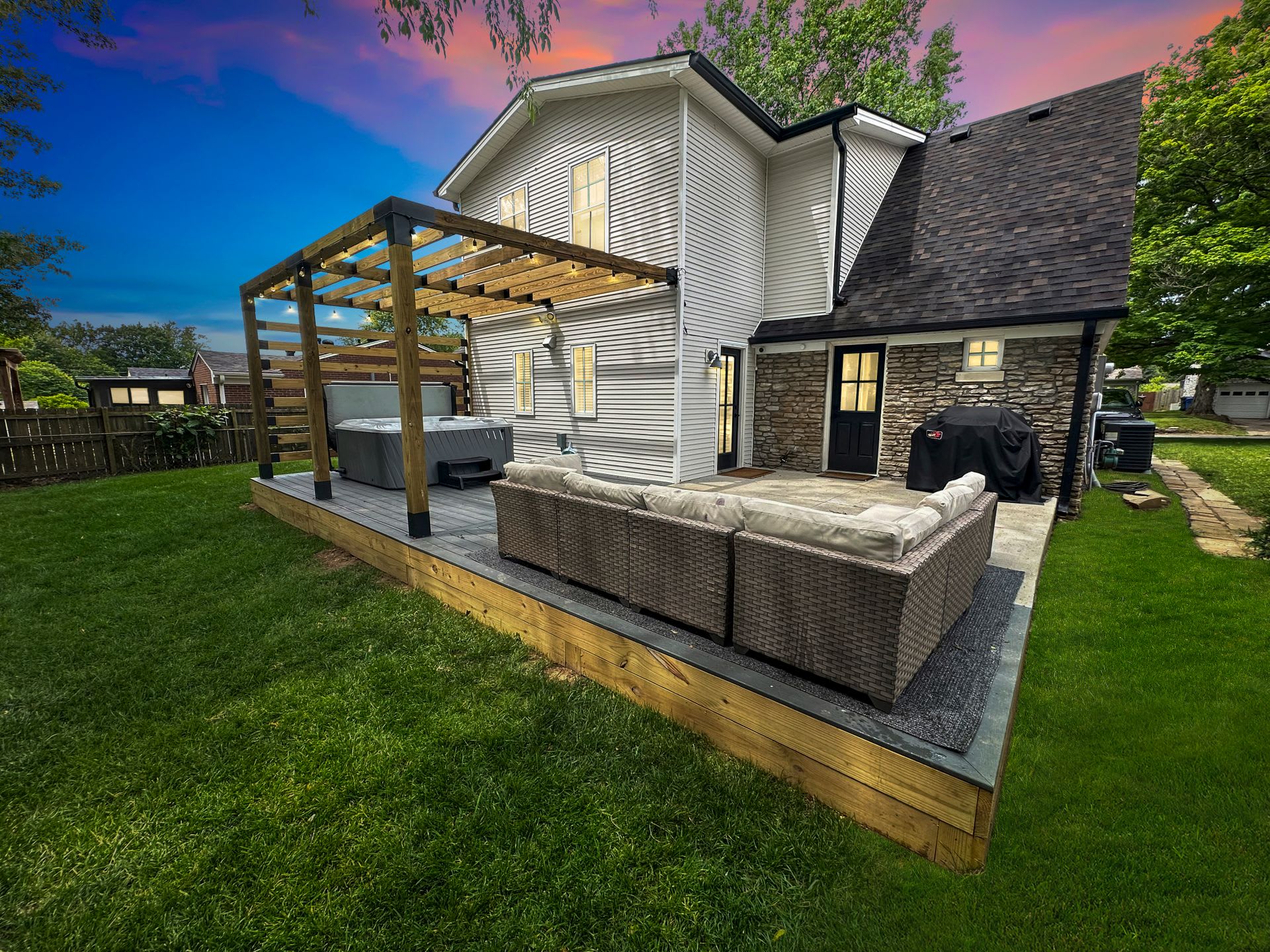 Slide into the hot tub as the sun sets behind the pergola — this is where day one of your trip ends and every day after starts.