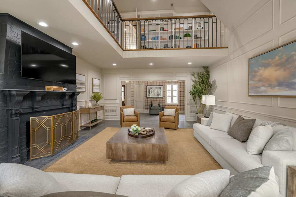 The kind of kitchen where you actually cook — marble island, stainless appliances, and enough bar stool seating that the chef stays in the conversation. Meals for twelve start here.