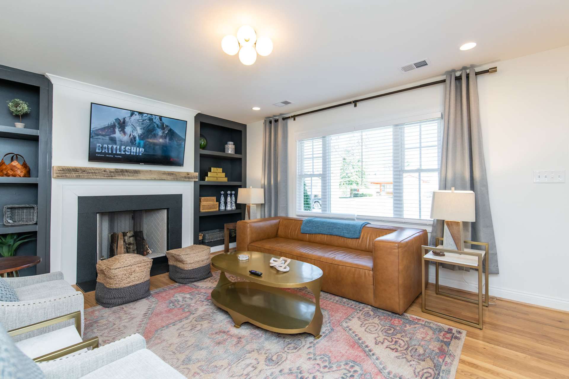 Kick your shoes off and claim the spot by the fireplace — flip on the TV, and let the group's first night together begin right here.