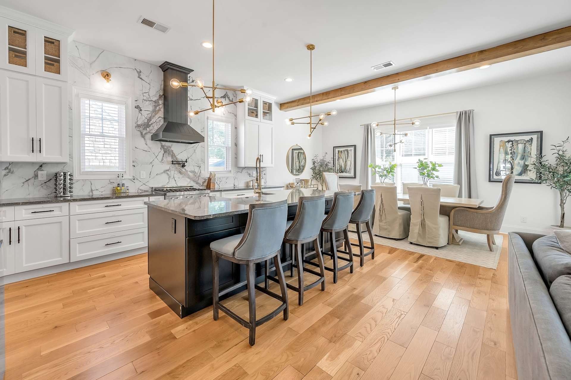 Cook a real meal for 12 without bumping elbows — gas range, full appliance suite, and island bar seating for four so the sous chefs have somewhere to stand.