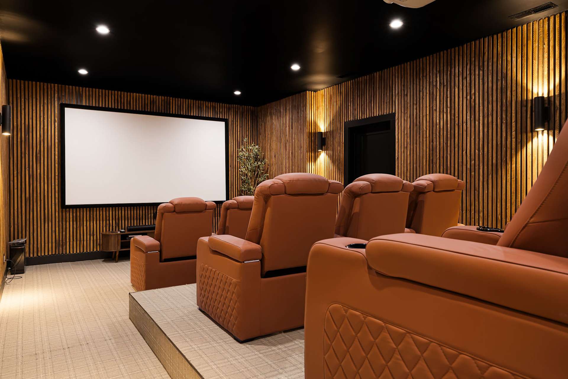 Experience cinematic comfort in the dedicated theater room. Dim lighting, plush seating, and a large screen create the ultimate space for relaxing movie nights and shared entertainment.
