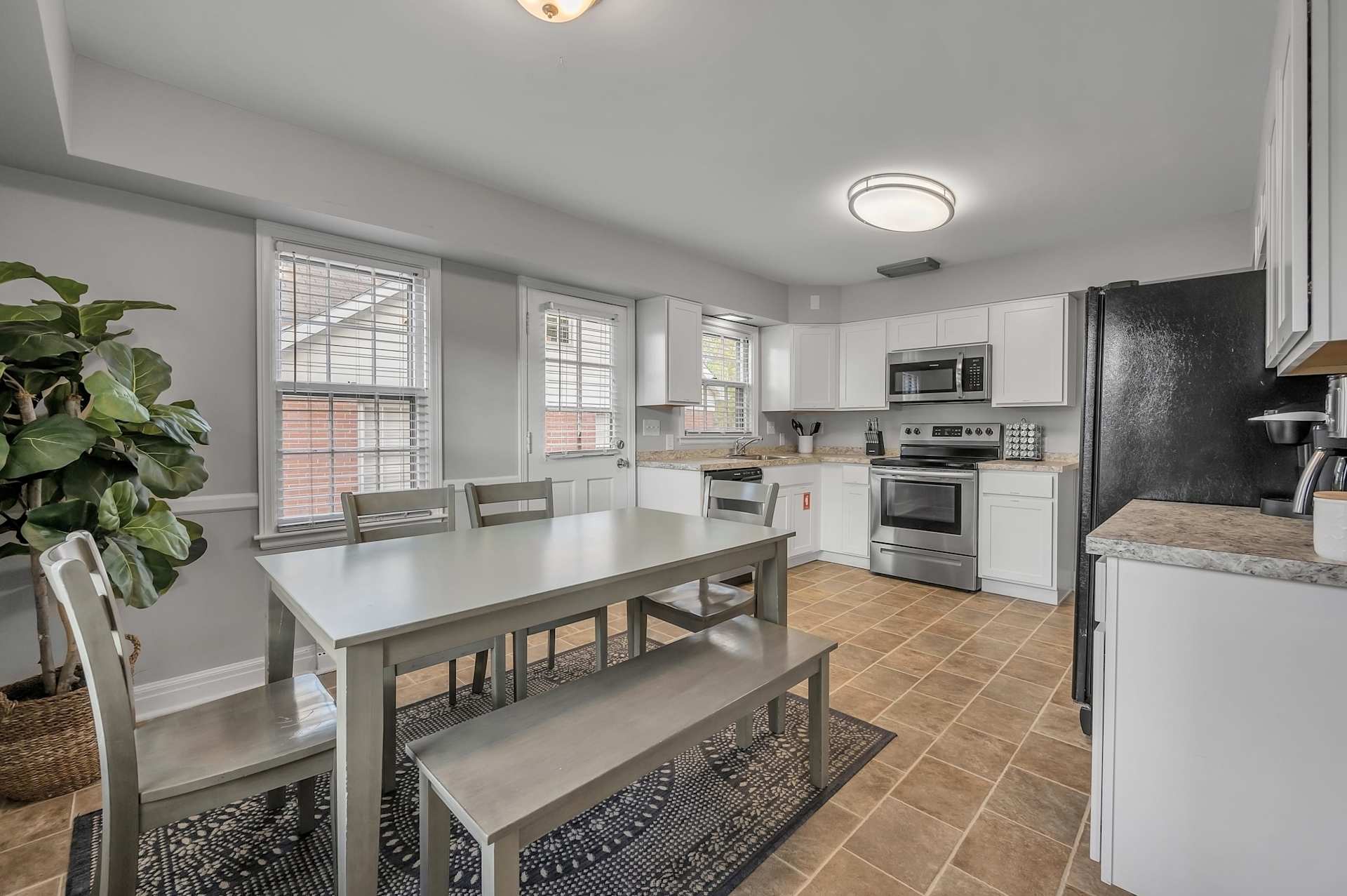 Welcome to our beautifully remodeled Airbnb kitchen, fully stocked for all your cooking needs. The modern design features sleek countertops and state-of-the-art appliances. Everything from the pots and pans to the spices are provided, making it easy to whip up a delicious meal.