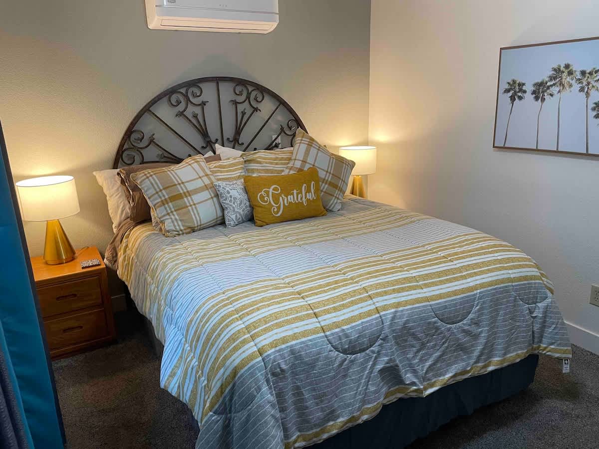 Your comfort queen size bed provides a luxurious night of sleep in this relaxing room. Blackout curtains allow you to sleep in late or take a nap during the day if you work at night