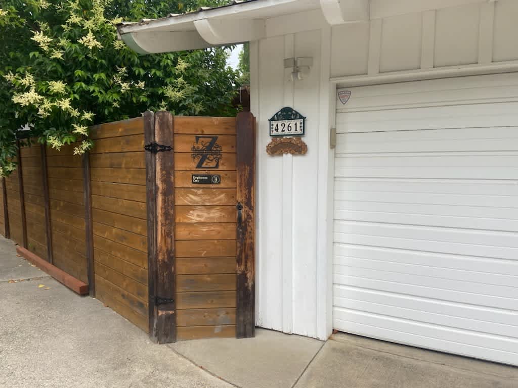 Press the thumb lever to pull the gate open