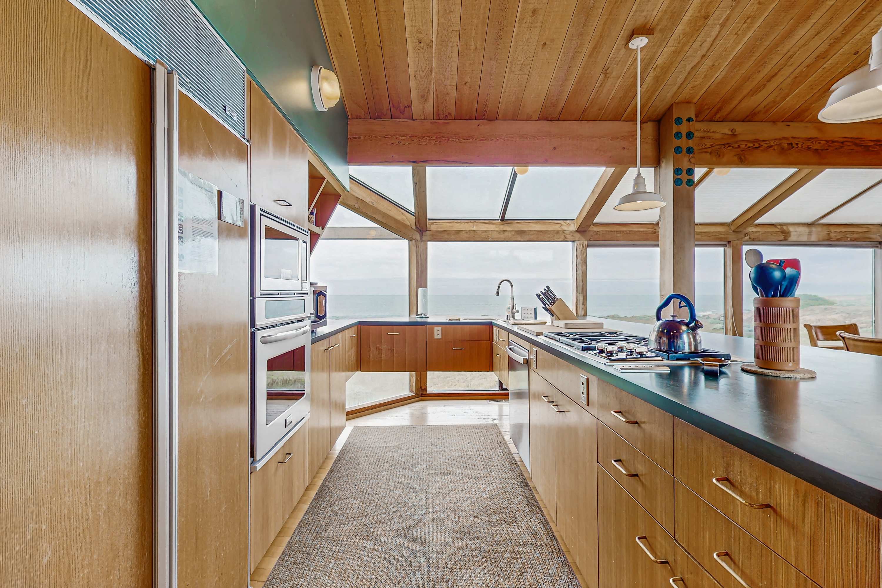 Cook your favorite meals in this modern kitchen, complete with breathtaking views that inspire culinary creativity.