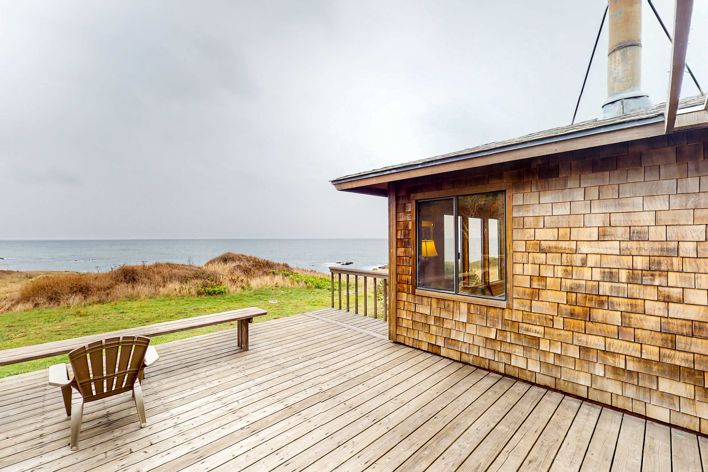 Breathe in the fresh coastal air on this spacious deck, where you can savor stunning ocean views and tranquil moments with loved ones.