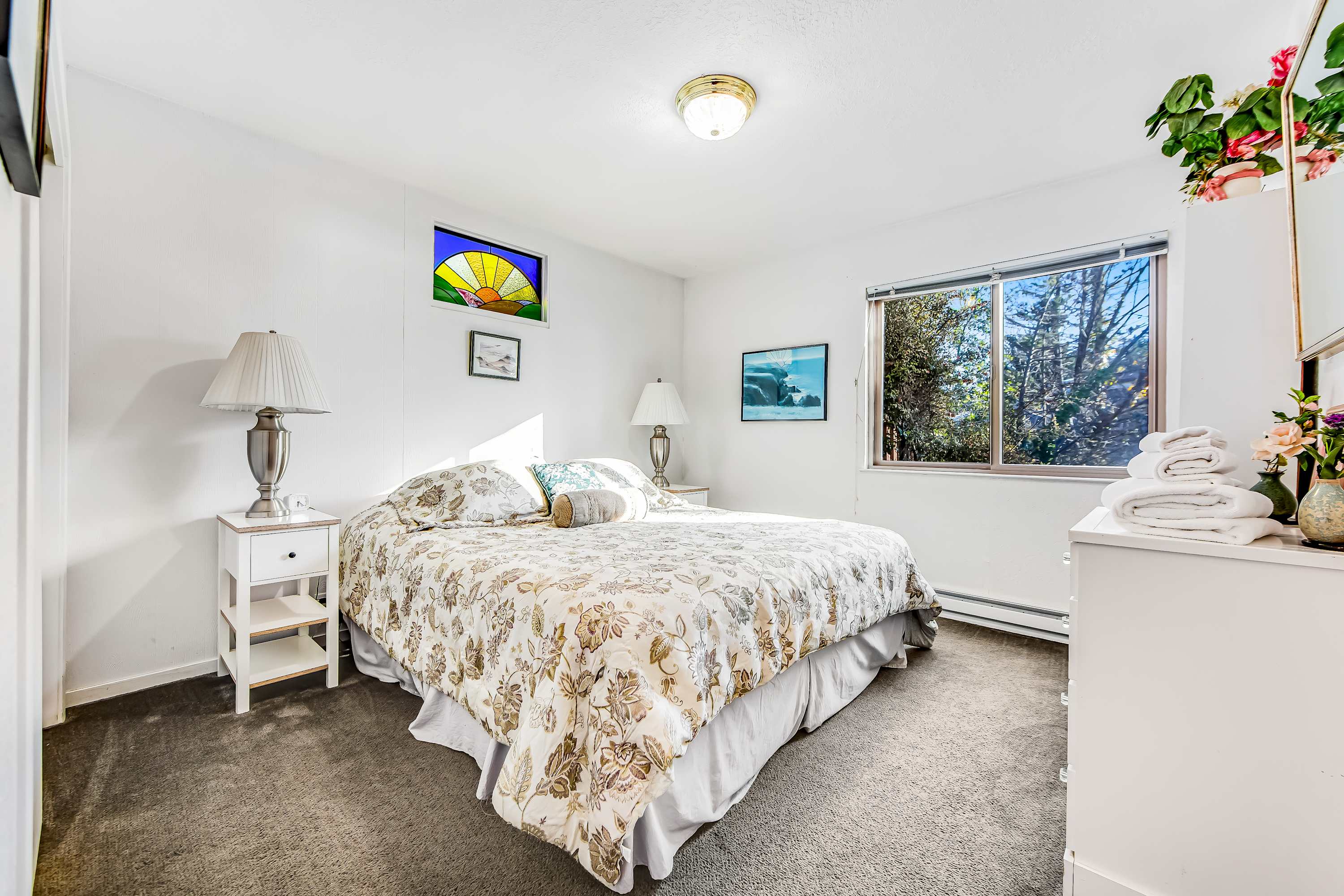 The tranquil master bedroom offers a peaceful retreat, with soft linens and natural light creating an inviting atmosphere.